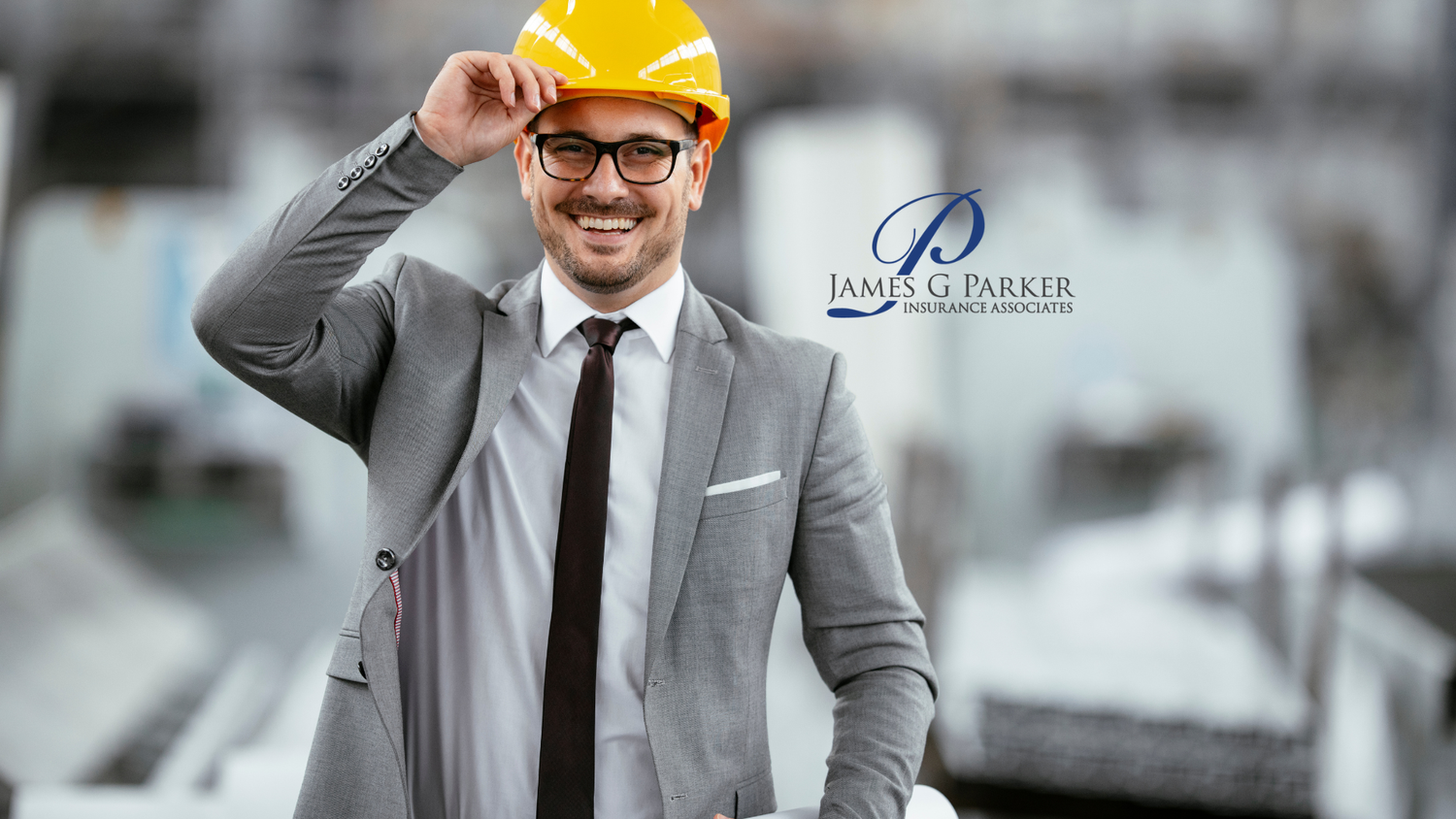 Man in suit and hard hat with James G. Parker Insurance Associates logo.